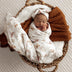 Baby wrapped in Butterfly Organic Muslin Wrap | Snuggle Hunny