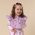 Toddler wearing Coral Frill Snuggle Bib | Snuggle Hunny