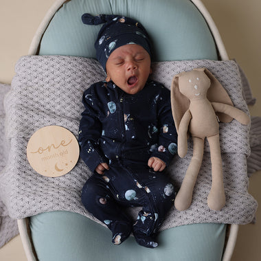 Baby wearing Milky Way Organic Snuggle Sleepsuit Zip Footie | Snuggle Hunny